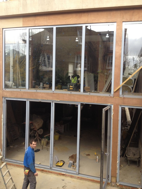 Aluminium bi-fold doors with two-storey glazing in Amersham