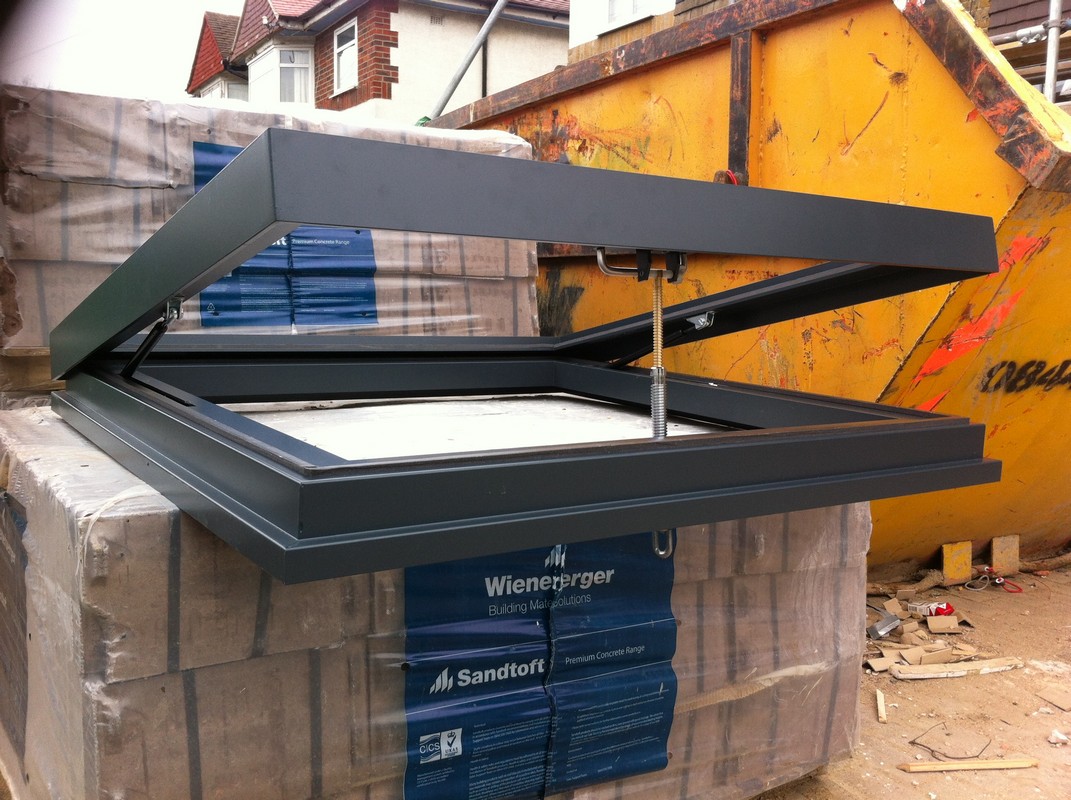 Opening flat roof skylight in anthracite grey installed in Amersham